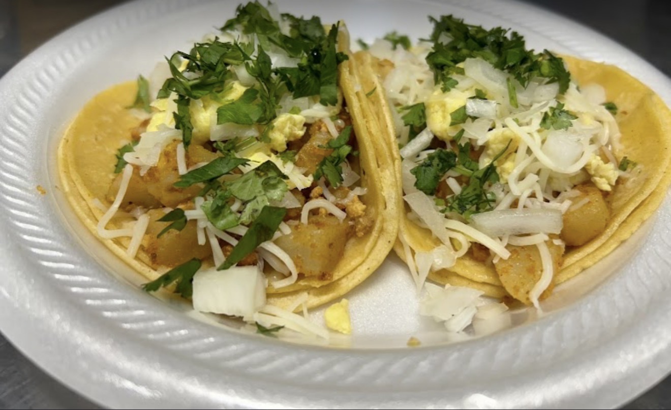 Marquez Food breakfast tacos topped with onion and cilantro